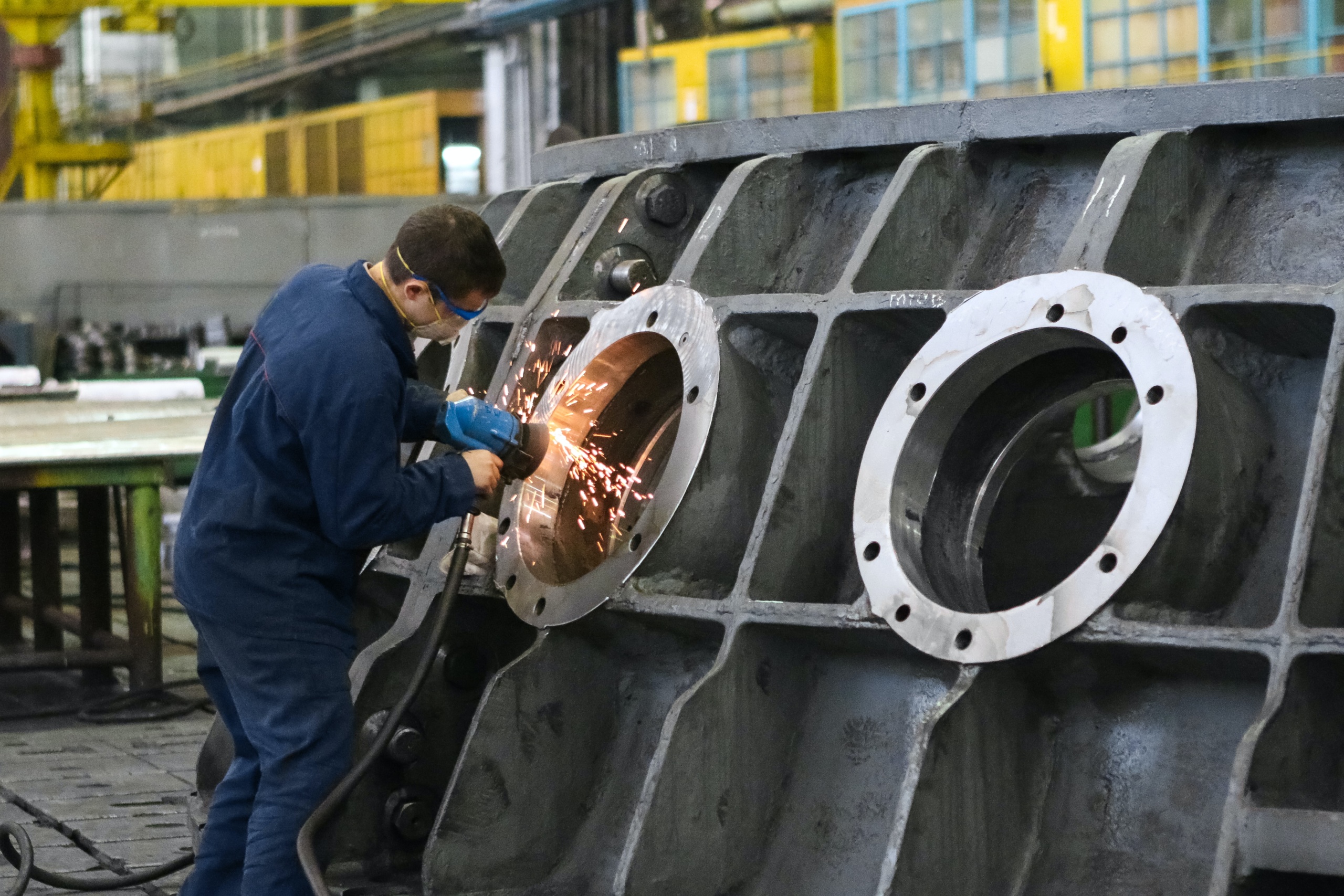 A mechanical engineer performing his duty at is workstation.