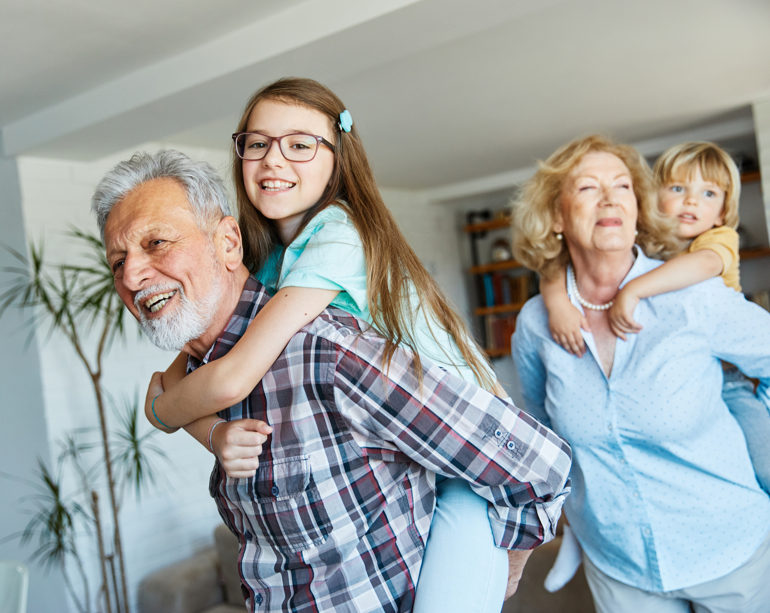 Portrait of grandparents and grandchildren having fun together at home